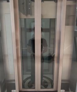 Thang máy vách kính inox gương vàng - chi tiết máy 2