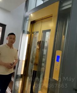 Thang máy vách kính inox gương vàng - chi tiết máy 3